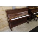 Woodchester (c1990s) An upright piano in a traditional satin mahogany case.