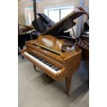 Bechstein London (c1930s) A 4ft 8in grand piano in a figured walnut case on square tapered legs.