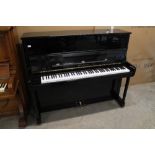 Bechstein (c1996) A 124cm Model Elegance upright piano in a bright ebonised case; together with a