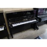 Ritter (c2016) A Model 123 upright piano in a bright ebonised case; together with a matching