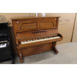 Steinway (c1889) An upright piano in a traditional rosewood case.