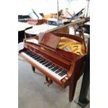 Zimmermann (c1980) A 4ft 6in grand piano in a bright mahogany case on square tapered legs.