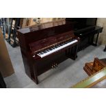 Schimmel (c2019) A Model 118T upright in a bright mahogany case.