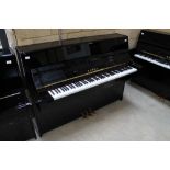 Kawai (c2011) A Model K15-ATX upright piano fitted with a silent system in a modern style bright