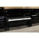 Yamaha (c1973) A Model U1H upright piano in a bright ebonised case. There is VAT on this Lot.