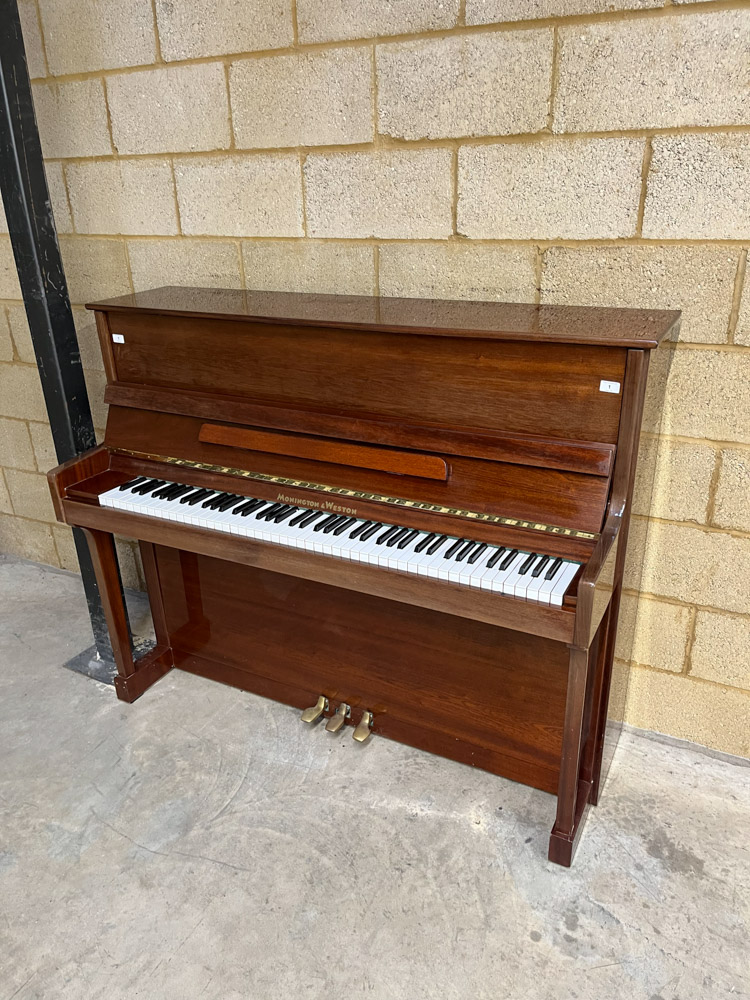 Monington and Weston (c2000) An upright piano in a traditional bright mahogany case.