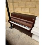 Petrof (c2002) An upright piano in a modern satin mahogany case.