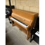 Schimmel (c1989) A Model W118 upright piano in a satin walnut case.