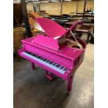 Edelweiss (c2000) A baby grand piano in a bright pink case on square tapered legs, fitted with a