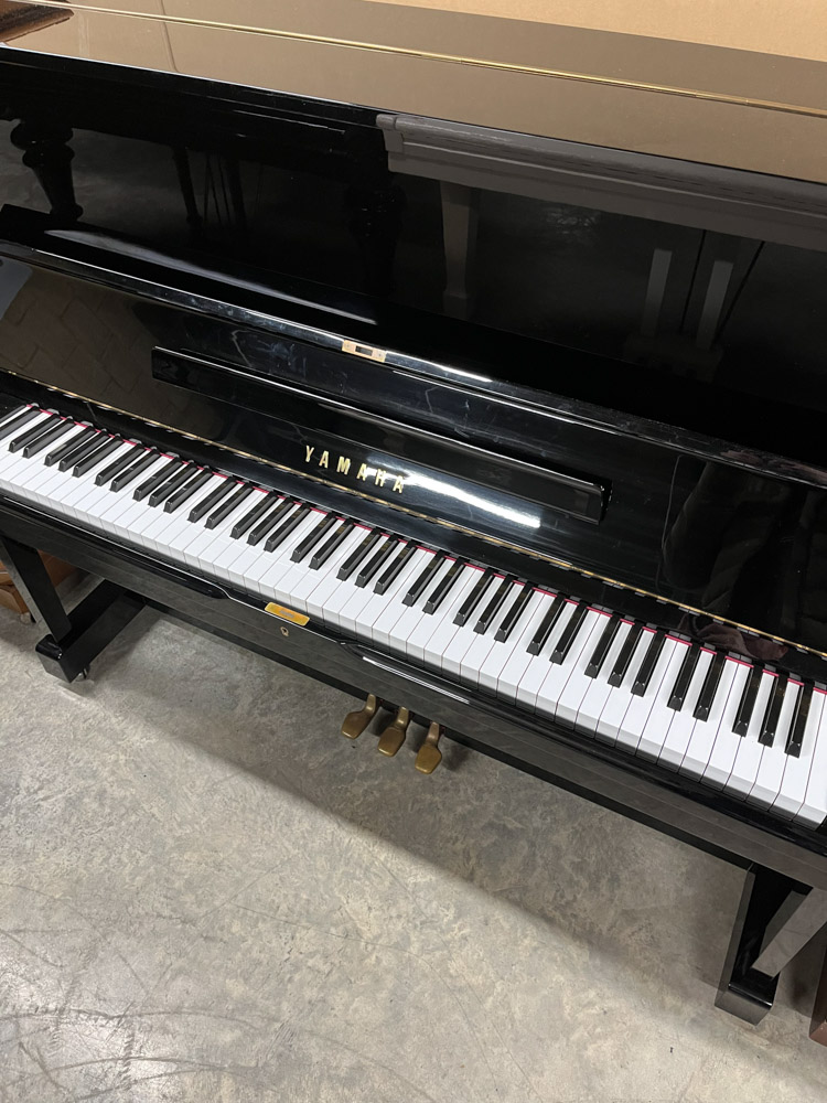 Yamaha (c1974) A Model U1 upright piano in a bright ebonised case; together with a matching stool. - Image 2 of 5