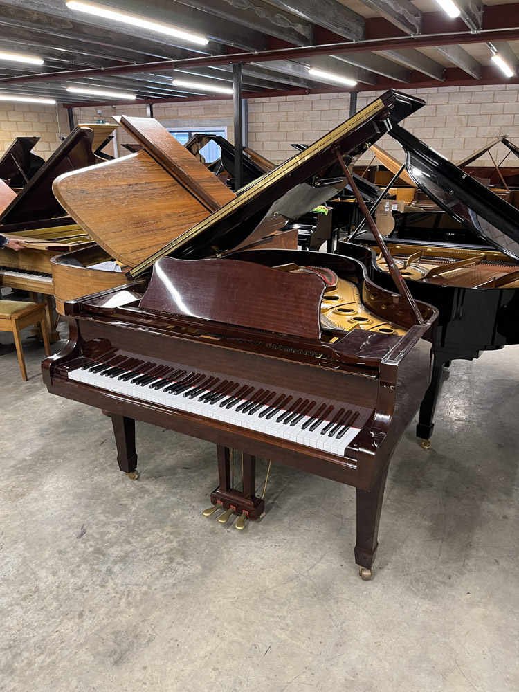 Elysian (c1991) A 6ft grand piano in a bright mahogany case on square tapered legs; together with