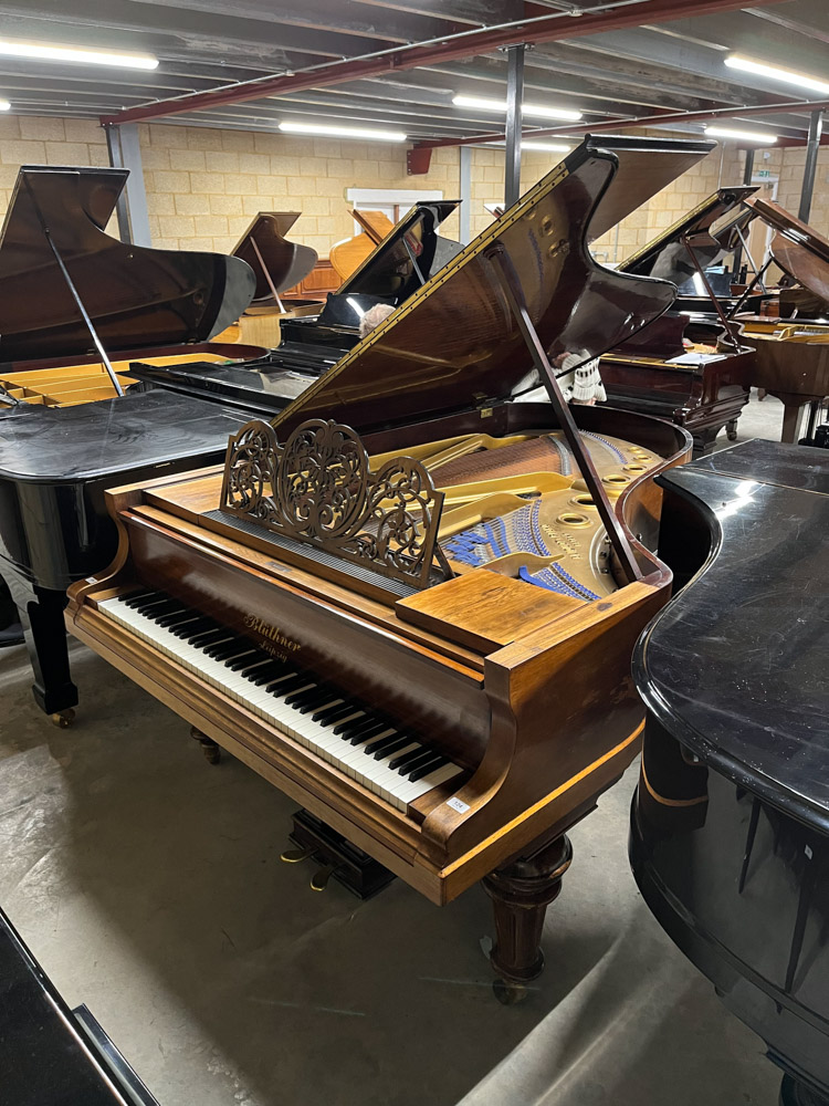 Blüthner (c1897) A 6ft 11in grand piano in a rosewood case on turned and fluted legs.