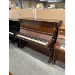 Steinway (c1914) An upright piano in a rosewood case.