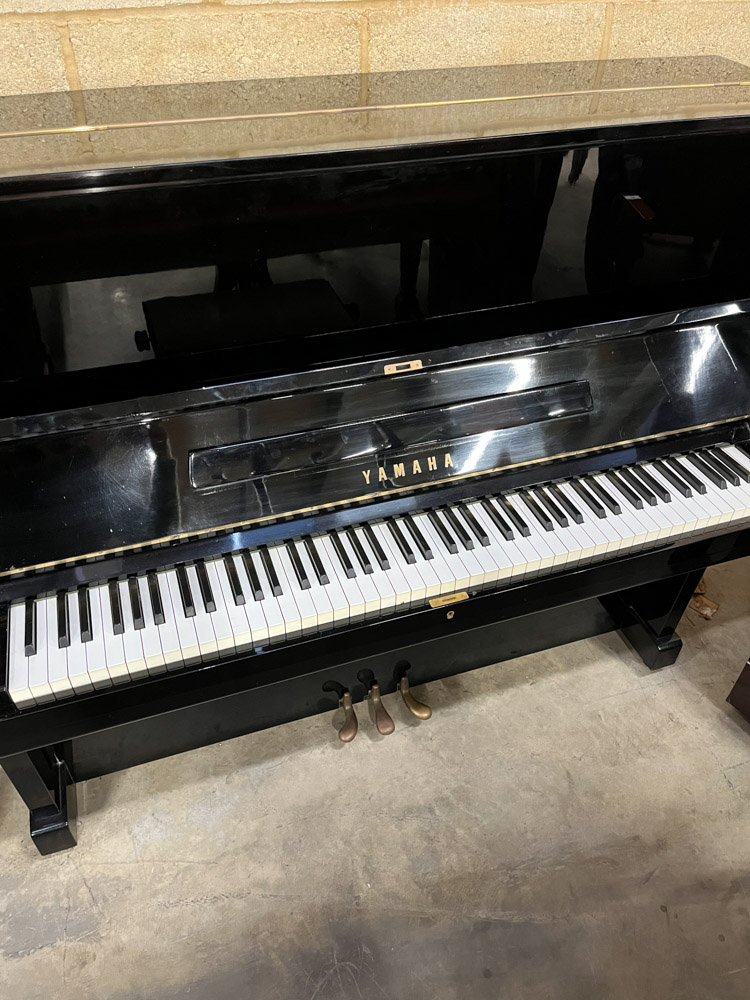 Yamaha (c1969) An upright piano in a bright ebonised case; together with a stool. - Image 2 of 5