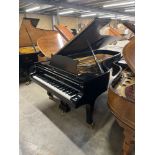 Steinway (c1956) A 9ft Model D concert grand piano in a satin ebonised case on square tapered legs.
