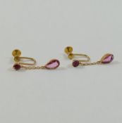 A pair of early 20th century yellow metal drop earrings set with pink paste, stamped '9CT',