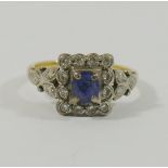 A yellow metal sapphire and diamond rectangular cluster ring,