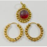 A pair of Indian yellow metal hoop earrings, unmarked, 13mm diameter,