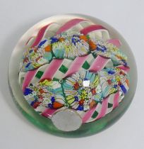 A collection of sixteen glass paperweights comprised of four Caithness examples including 'Flowers