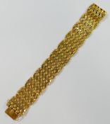 A yellow metal flat link bracelet, with hollow geometric links, 2.