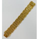 A yellow metal flat link bracelet, with hollow geometric links, 2.