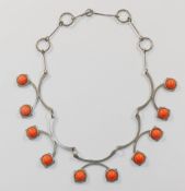A silver plated and simulated coral articulated necklace, unmarked,