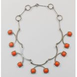 A silver plated and simulated coral articulated necklace, unmarked,