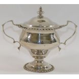 A small late Victorian silver two-handled pedestal lidded trophy cup, London 1895, 5.44ozt, 169.