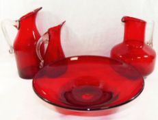 Three Whitefriars ruby glass jugs, the tallest 21.