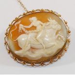 An oval carved shell cameo brooch depicting Europa riding the bull,