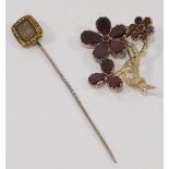 A garnet set floral spray brooch, set in yellow closed back settings, 3.