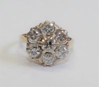 A diamond daisy head cluster ring,