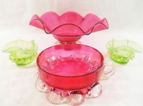 A pair of small Victorian vaseline glass bowls with pinched rims and wavy bands to the waist,