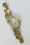 A ladies 9 carat gold cased 'Everite' watch with gold plated bracelet strap,