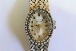 An 18 carat white gold ladies Victoria International bracelet watch, with import marks for 1976, 28.