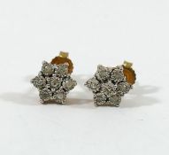 A pair of diamond daisy head cluster earrings, the eight-cut meleè diamonds in illusion setting,