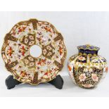 An early 20th century Royal Crown Derby Imari pattern high sided dish with red printed factory mark
