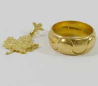 An 18 carat gold band, Birmingham 1977, 7mm wide, finger size K,