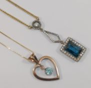 A rose coloured open heart-shaped pendant, set with a blue zircon drop, 3cm long,