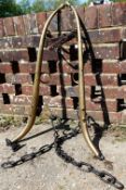 A pair of 19th century brass and iron horses hames, with leather strap, stamped 'Patent,