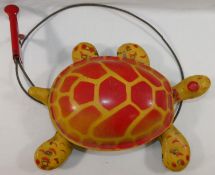 A late 1940s/50s Mobo 'Toy-toise' tin plate tortoise with cable mechanism,