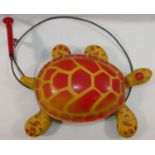 A late 1940s/50s Mobo 'Toy-toise' tin plate tortoise with cable mechanism,