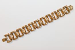 An Art Deco heavily gold plated hollow link bracelet,