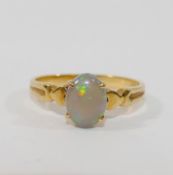 A yellow metal opal single stone ring, the shank stamped '750', finger size L, 2.