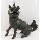 A Chinese bronze incense burner in the form of a Qilin (Chinese unicorn),
