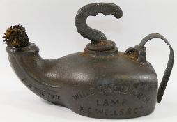 A cast iron torch lamp by A C Wells and Co., inscribed 'Well's Single Torch Lamp', 'No.