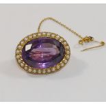 A Victorian oval amethyst and half pearl brooch, the oval mixed cut amethyst,