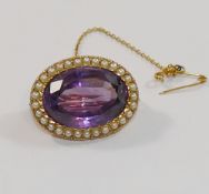 A Victorian oval amethyst and half pearl brooch, the oval mixed cut amethyst,
