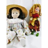 A Pelham puppet 'Gretel' 31cm long, and a cloth doll, with fabric covered moulded face,