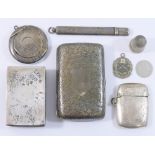 A collection of small silver items comprised of a matchbox holder, thimble, cigarette case,